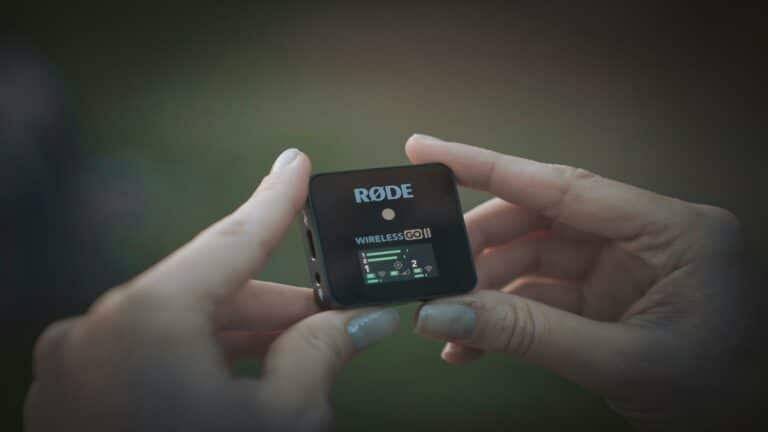 Mobile-friendly RDE Wireless GO II audio receiver displayed in hands with digital interface for seamless mobile recording