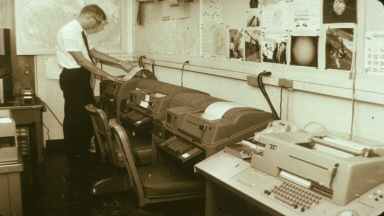 Vintage office setup showcasing teleprinters and communication devices, emphasizing social media strategy evolution