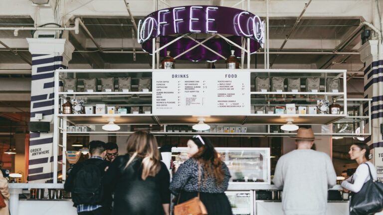 Coffee shop counter showcasing drinks and food menu, ideal for website maintenance tips