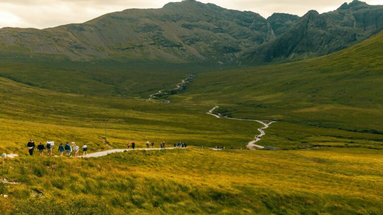 Group of hikers walking on a scenic trail in the Highlands to increase website engagement