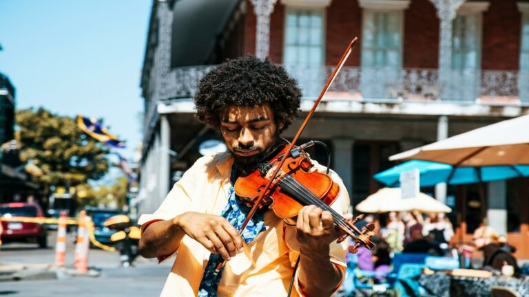 Street violinist playing in a vibrant outdoor setting in London